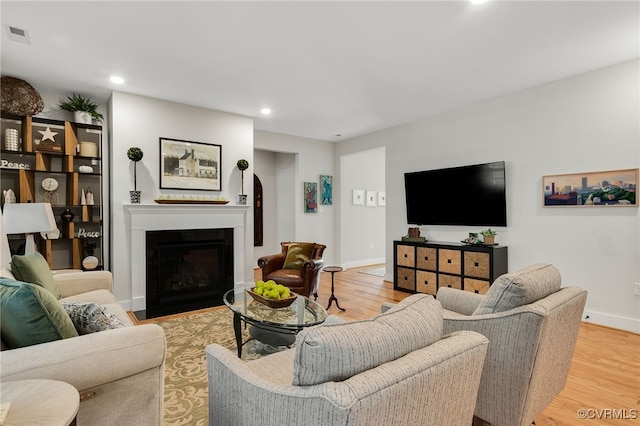 living room with light hardwood / wood-style flooring