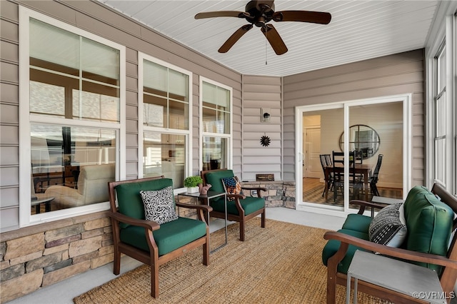 sunroom / solarium with ceiling fan