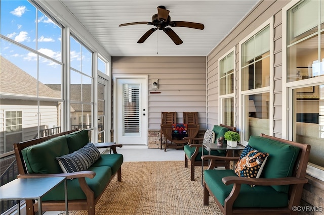 sunroom / solarium with ceiling fan