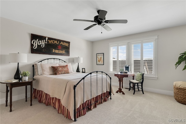 bedroom featuring ceiling fan and light colored carpet