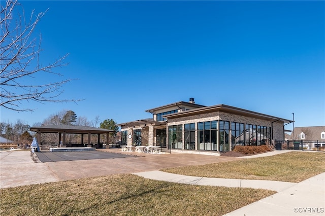 exterior space featuring a gazebo and a yard