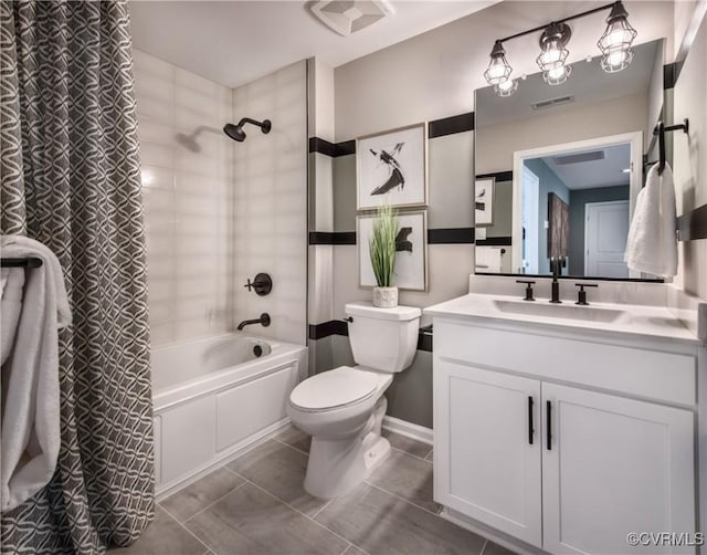 full bathroom with shower / tub combo with curtain, vanity, and toilet