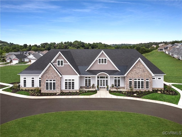 view of front of home featuring french doors and a front lawn