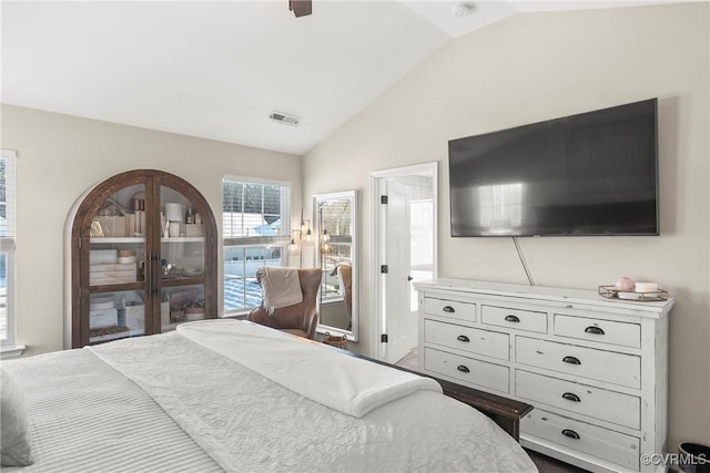 bedroom with ceiling fan and vaulted ceiling