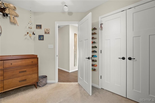 hallway with light colored carpet