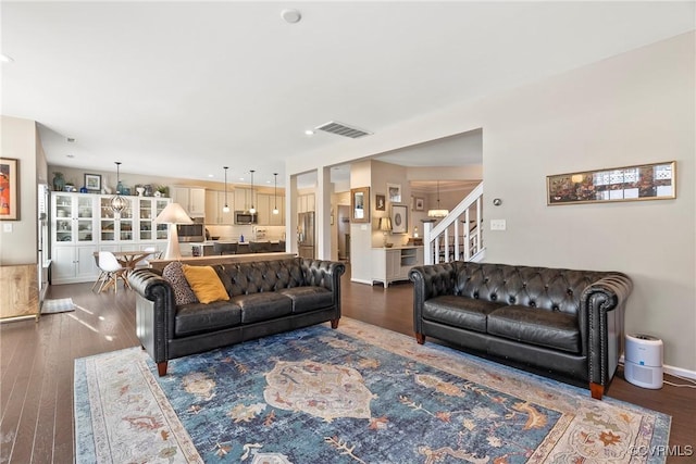 living room with dark wood-type flooring