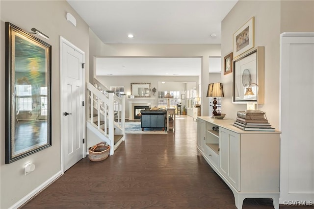 hall with dark hardwood / wood-style floors