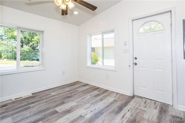 entrance foyer featuring vaulted ceiling, light hardwood / wood-style floors, and ceiling fan