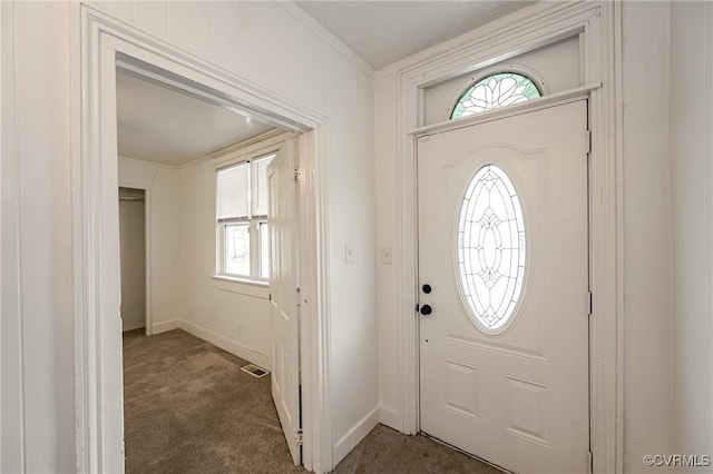 entryway with dark colored carpet