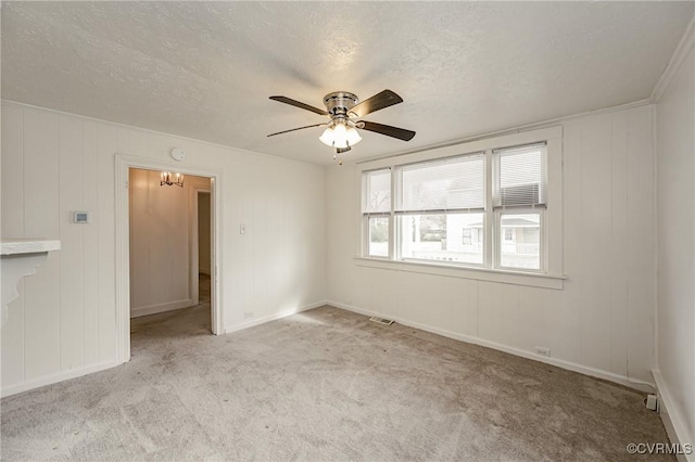 unfurnished room with light carpet, ceiling fan, and a textured ceiling