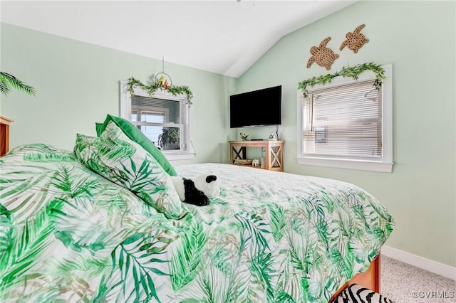 bedroom with vaulted ceiling and carpet