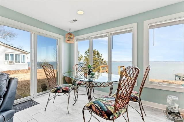 sunroom with a water view