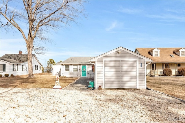 rear view of house featuring a yard