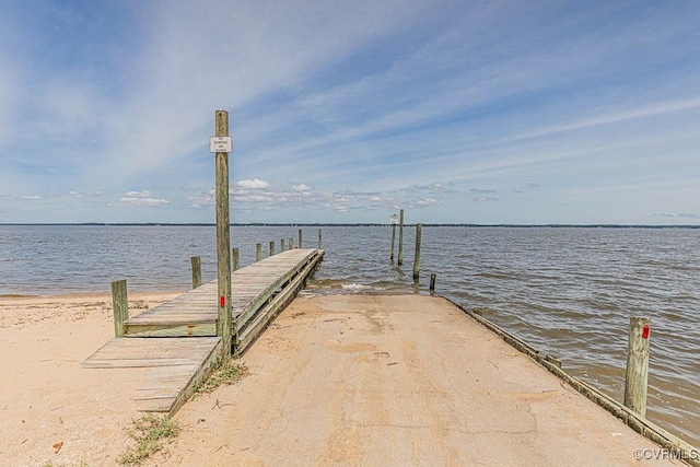 dock area with a water view