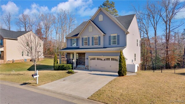 front of property featuring a porch, a garage, and a front lawn