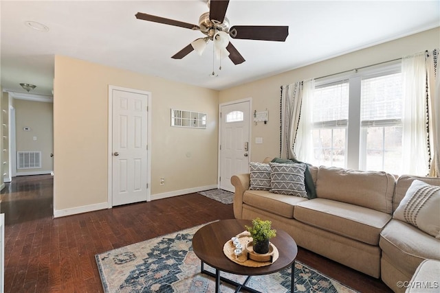 living room with dark hardwood / wood-style flooring and ceiling fan