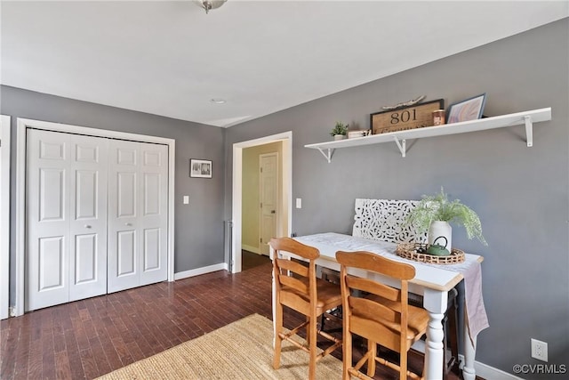 dining room with dark hardwood / wood-style floors