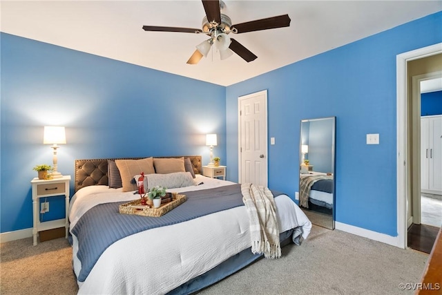 bedroom featuring ceiling fan and light colored carpet