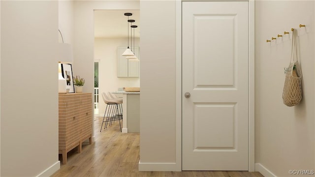 hall with light hardwood / wood-style flooring