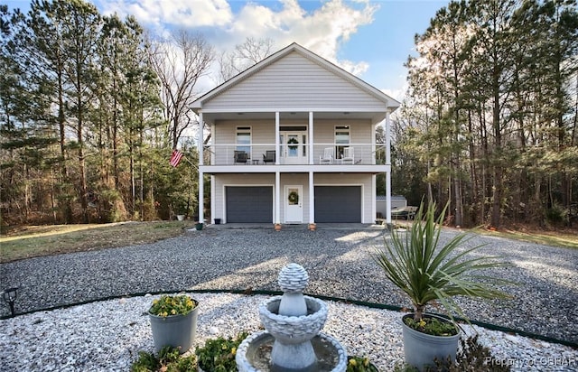 view of front of home with a balcony and a garage