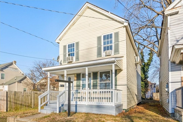 view of property featuring covered porch