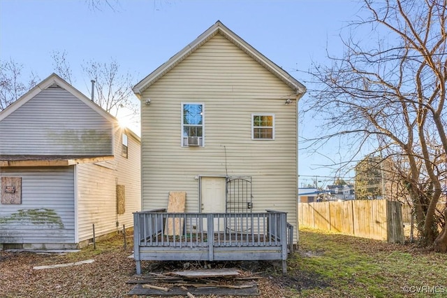 back of property with a wooden deck