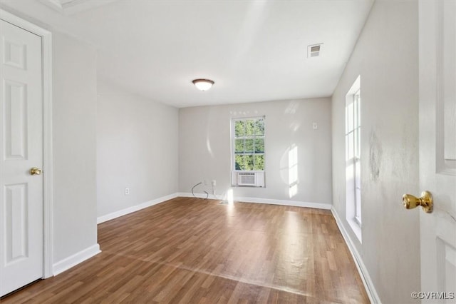 spare room with hardwood / wood-style flooring