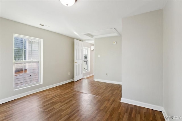 unfurnished room featuring dark hardwood / wood-style floors