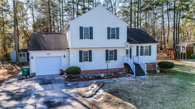 view of property with a carport and a garage