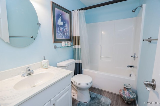 full bathroom featuring shower / tub combo, hardwood / wood-style floors, vanity, and toilet