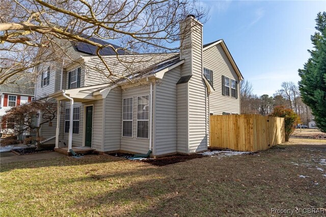 view of home's exterior featuring a yard