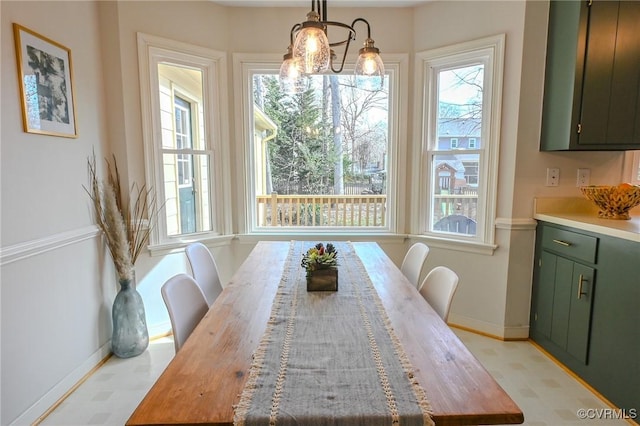 dining area with a notable chandelier