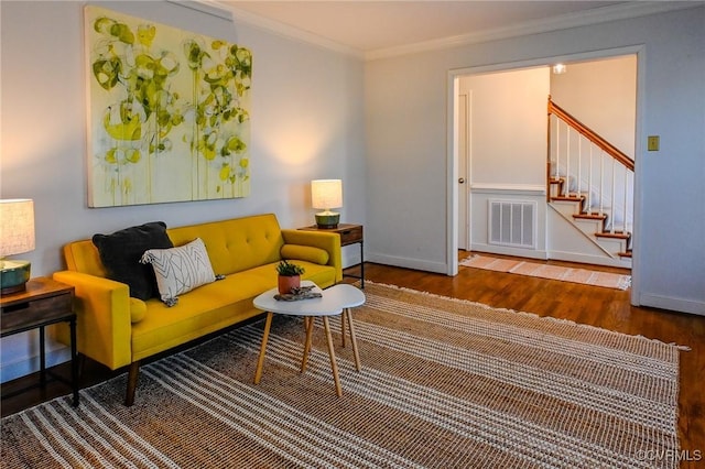 living room featuring crown molding and wood-type flooring