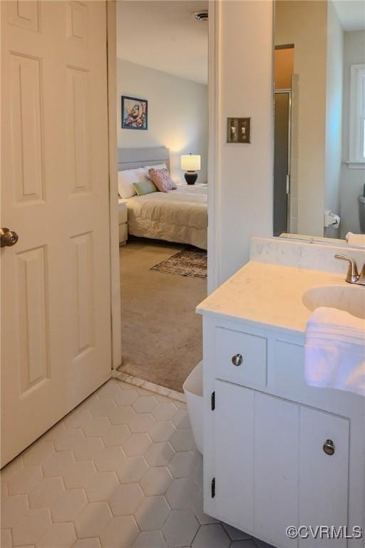 bathroom featuring vanity, an enclosed shower, tile patterned floors, and toilet