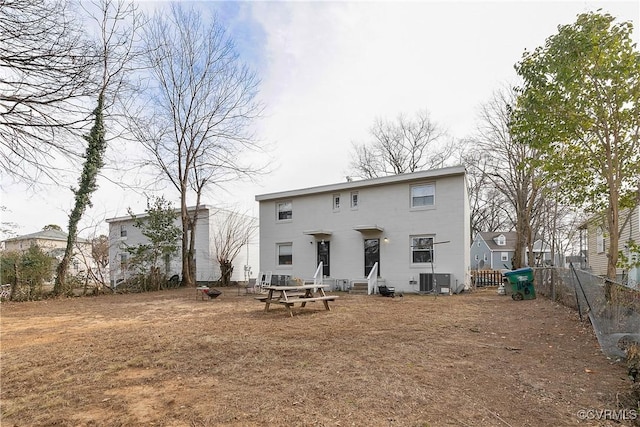 rear view of property featuring central air condition unit