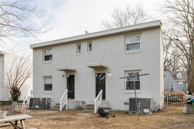 back of house featuring central air condition unit