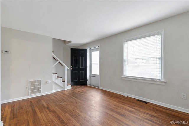 foyer entrance with hardwood / wood-style floors and a wealth of natural light