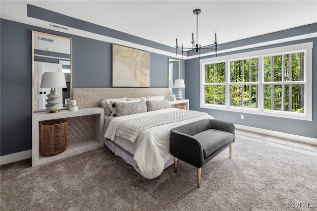 bedroom with a notable chandelier and carpet