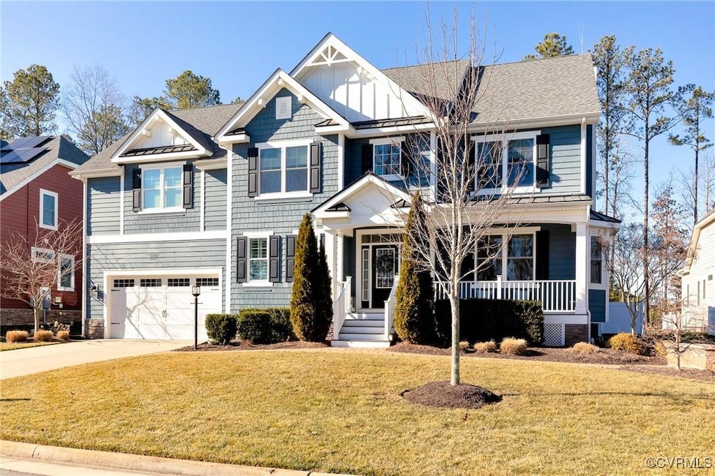 view of front of house featuring a garage and a front yard