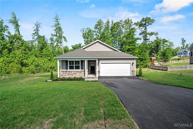 view of front facade featuring a garage, a front yard, and a playground