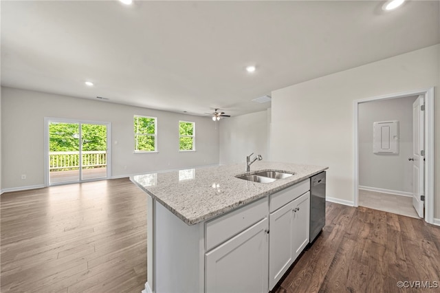 kitchen featuring white cabinetry, an island with sink, dishwasher, and sink