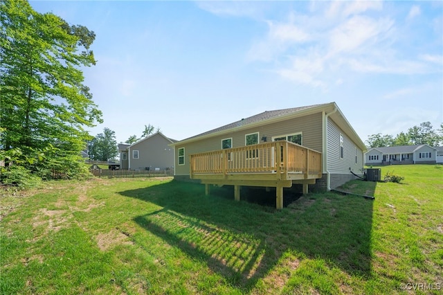 back of house featuring a wooden deck, a yard, and central air condition unit