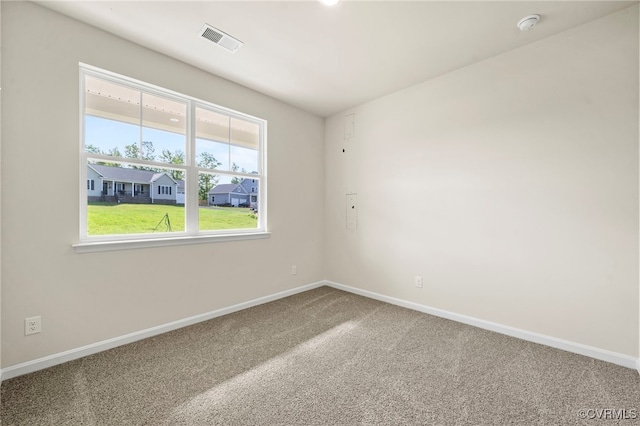 unfurnished room with carpet floors