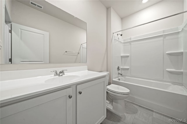 full bathroom featuring shower / bath combination, vanity, and toilet