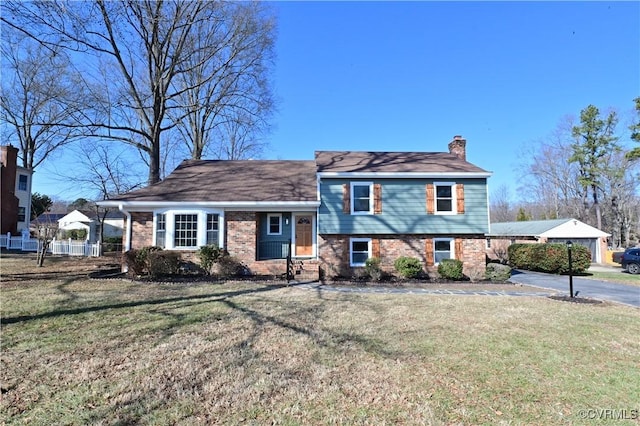 tri-level home with a front lawn