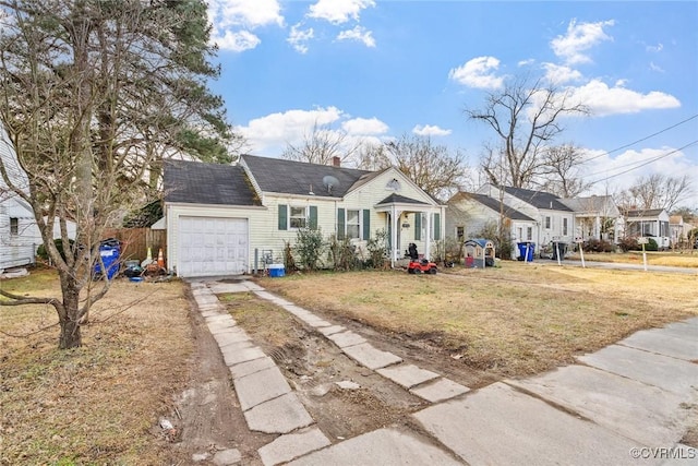 view of front facade featuring a garage and a front lawn