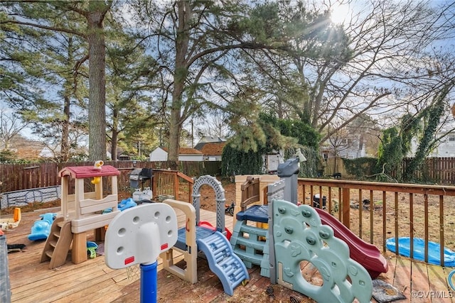 view of playground featuring a deck