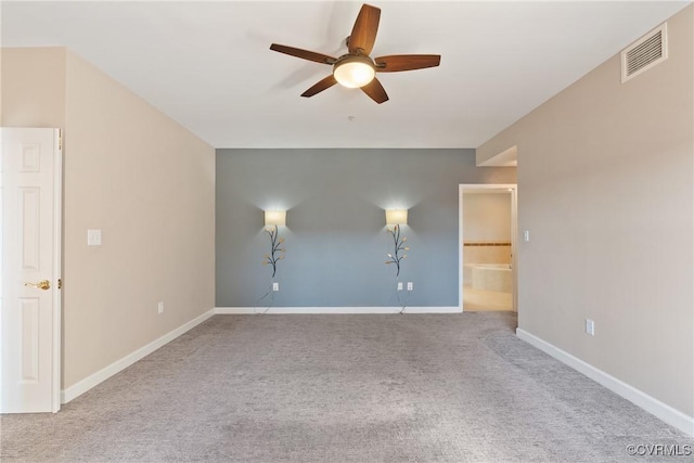 unfurnished room with ceiling fan and light carpet