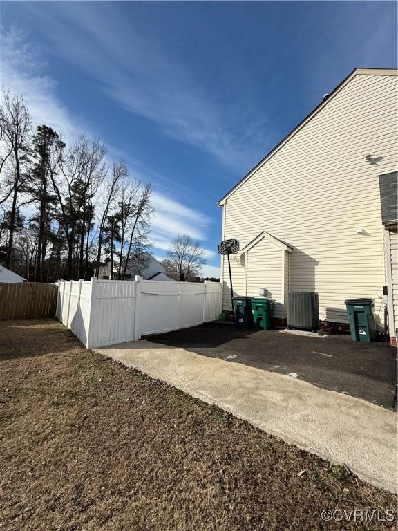 view of property exterior with central AC unit