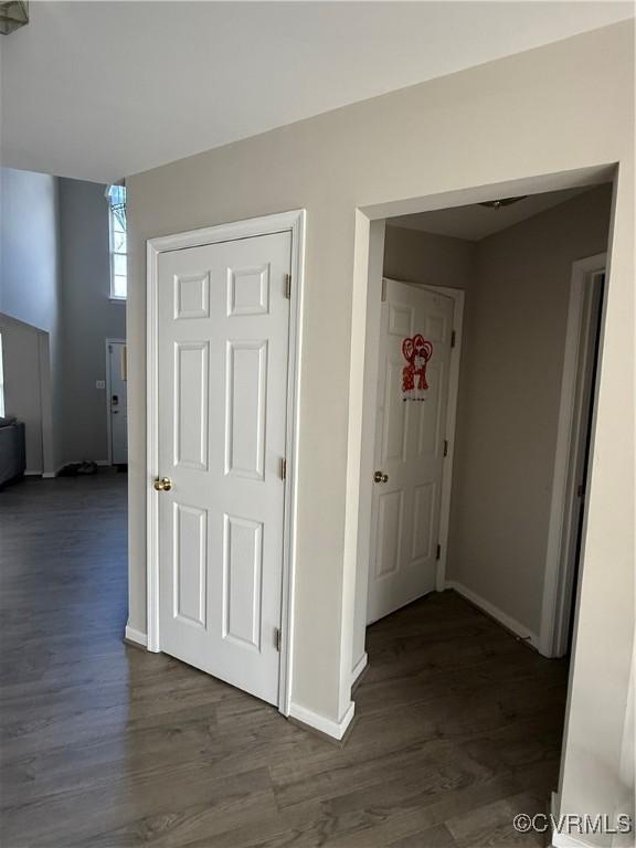 corridor featuring dark hardwood / wood-style flooring